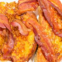 French Toast With Bacon · 2 slices of our thick bread dipped in fresh eggs, cream and cinnamon. Served with butter and...