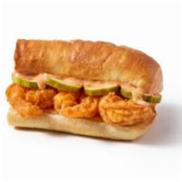 Shrimp Po'Boy Sandwich · Double hand breaded shrimp, our signature sauce, and dill pickle slices on a buttered toaste...