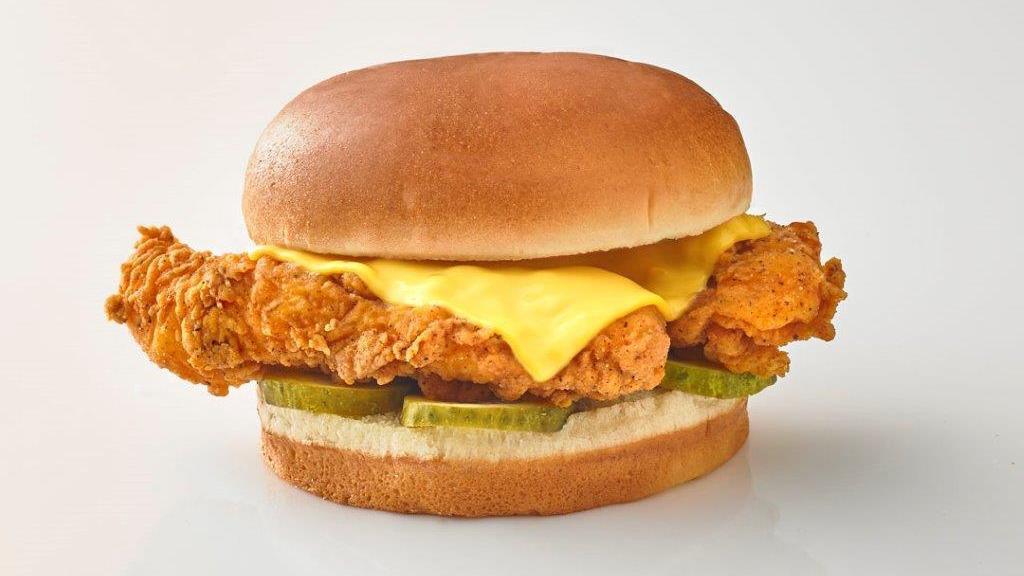 Chicken And Cheese Sandwich · 2 Double Breaded Chicken Tenders with American Cheese on a Buttered Brioche Bun with Dill Pickle Slices.