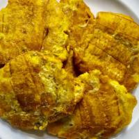 Fried Green Plantains / Tostones · Tostones.