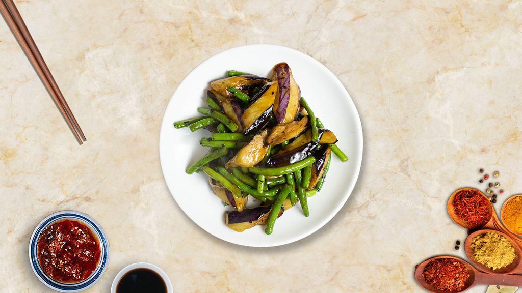Eggplant On String Beans · Sautéed eggplant in basil garlic sauce on a bed of string beans.