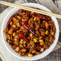 Kung Po Chicken · Spicy.  Diced chicken stir fried with peanuts, szechuan style.