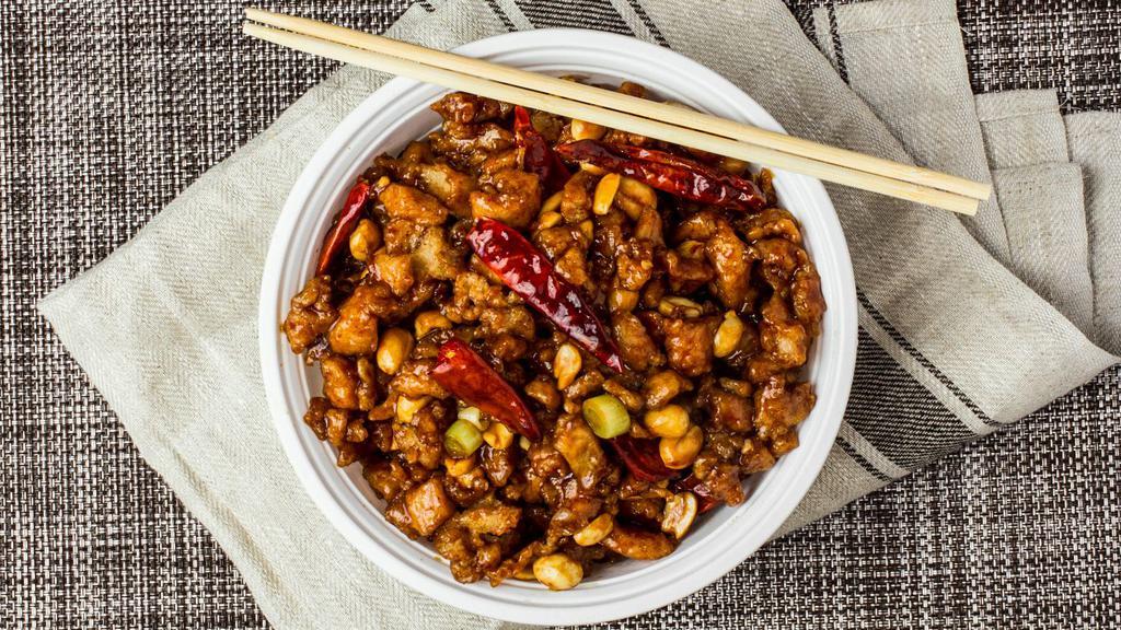 Kung Po Chicken · Spicy.  Diced chicken stir fried with peanuts, szechuan style.
