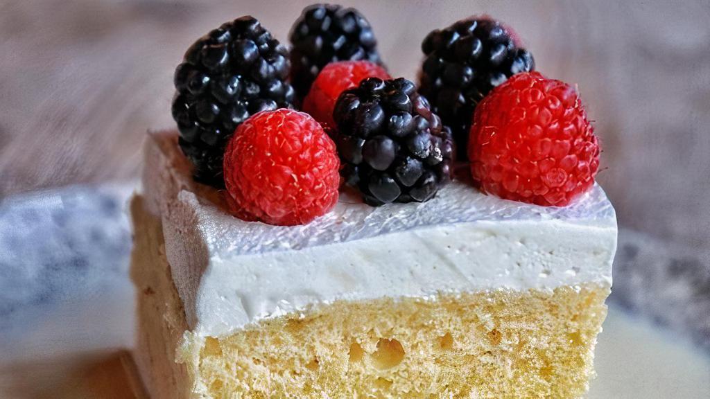 Tres Leches Cake · Marscapone , evaporated, condensed and heavy cream milks. Topped with berries