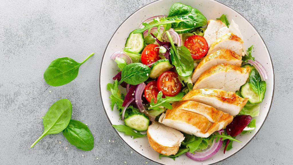 Grilled Chicken Salad · Fresh greens with grilled chicken and your choice of dressing.