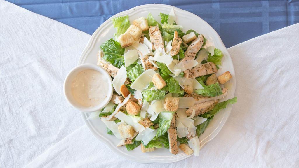 Grilled Chicken Caesar Salad - Large · Crisp romaine lettuce tossed in Caesar dressing topped with chicken.