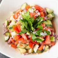 Shepherd Salad · Gluten Free, Vegetarian, Dairy-free.

Chopped tomatoes, parsley, cucumber, onions, tossed wi...