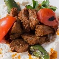 Ali Nazik · Gluten Free.

Eggplant puree with yogurt served with seasoned (Choice) grilled lamb shish, c...