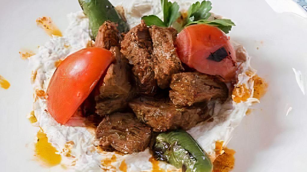 Ali Nazik · Gluten Free.

Eggplant puree with yogurt served with seasoned (Choice) grilled lamb shish, chicken, or lamb adana.
