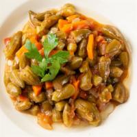 Okra · Vegan.

Bamya. Baby okras with tomatoes and onions sauteed in tomato sauce and served with r...