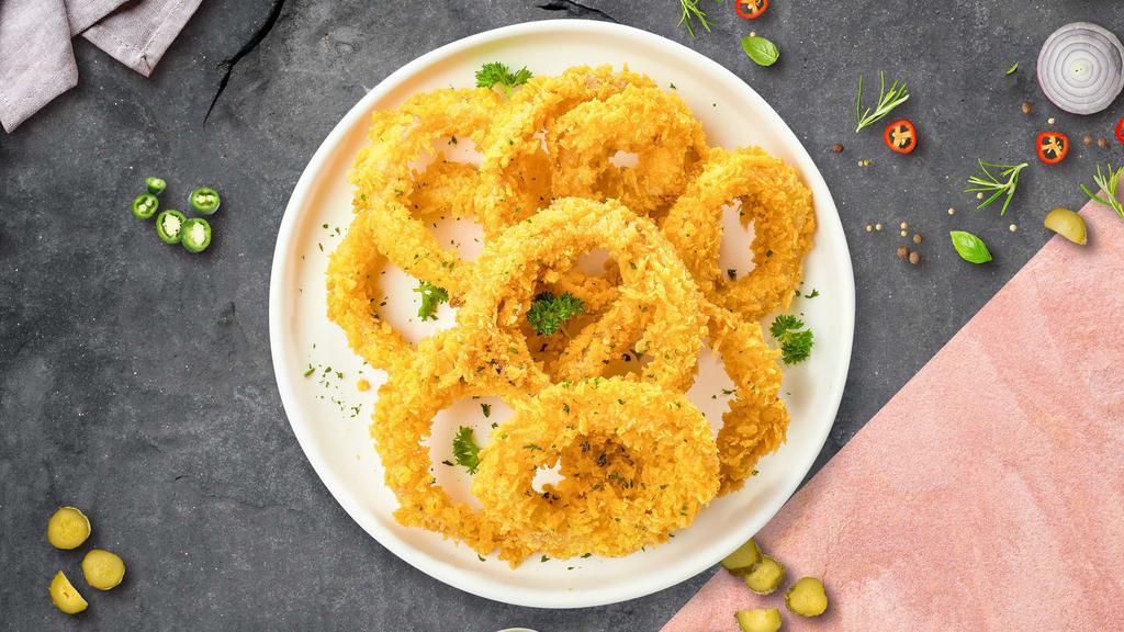 Onion Rings · (Vegetarian) Sliced onions dipped in a light batter and fried until crispy and golden brown.