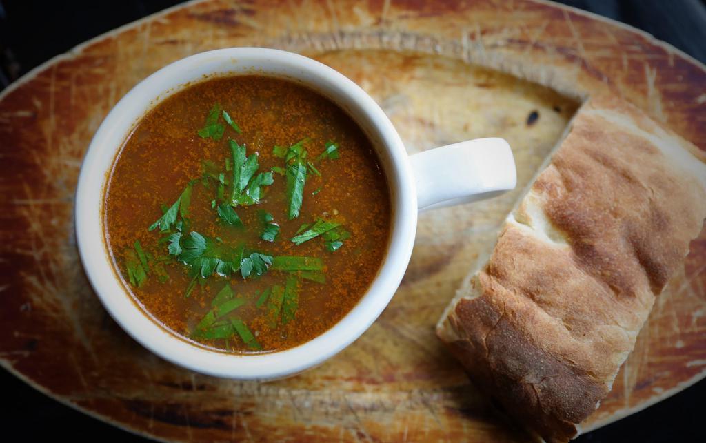 Kharcho Soup · Organic, grass-fed beef soup with rice, tomatoes, and Georgian spices. Served with Georgian bread.