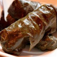 Tolma · Organic grass-fed ground beef & pork with fresh herbs wrapped in grape leaves, served with y...