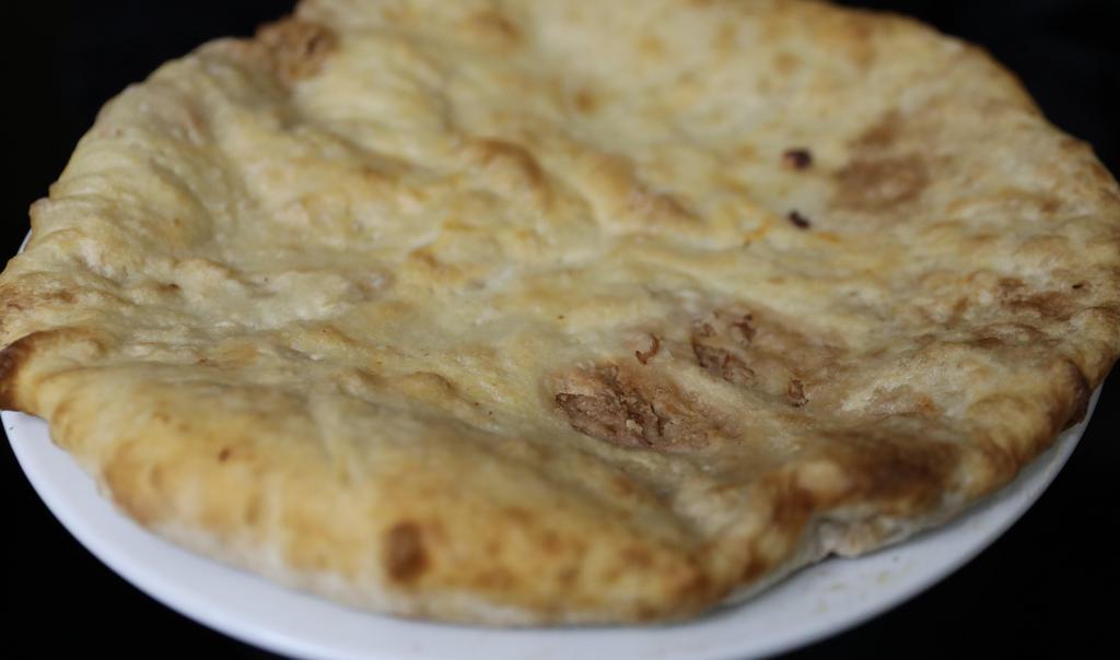 Lobiani · Mashed pinto beans baked inside yeast dough.