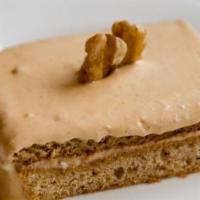 Ideali · Honey cake, iced with whipped condensed milk, and garnished walnuts. Vegetarian.