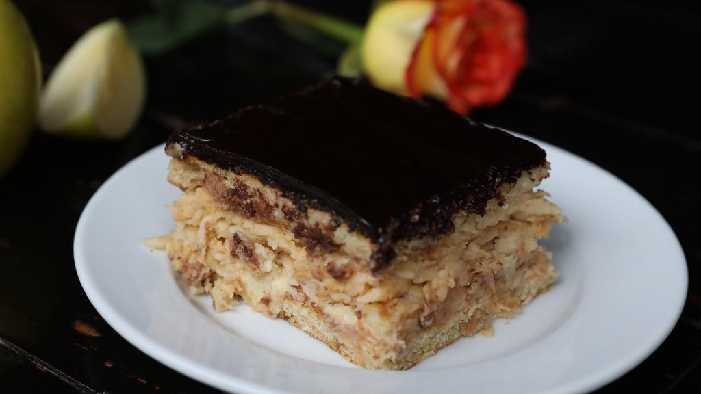 Maia'S Cake · Layer cake with fresh apples and homemade Bavarian cream topped with homemade chocolate.
