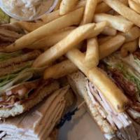 Turkey Breast Triple Decker · With bacon. Triple decker, lettuce, tomato, mayonnaise, fries, coleslaw, and pickle.