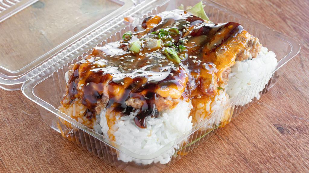 Dynamite Maki · California Maki with spicy ahi and green onion on top with superman sauce and unagi sauce (torched)