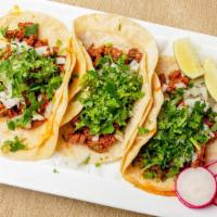 Bistec Taco · Steak. Served with cilantro and onion.