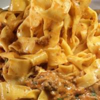 Pappardelle Francesco Lunch · Fresh pappardelle pasta topped with our delicious dried shiitake mushroom and ground beef ra...