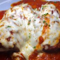 Eggplant Rollatini · Battered eggplant rolled with seasoned ricotta cheese and baked with tomato sauce and mozzar...