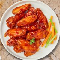 Buffalo Heat Wings · (Ten pieces) Fresh chicken wings breaded, fried until golden brown, and tossed in buffalo sa...