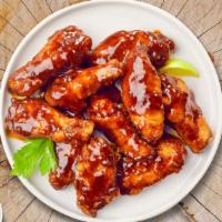 Bbq Grill Wings · (Ten pieces) Fresh chicken wings breaded, fried until golden brown, and tossed in barbecue s...