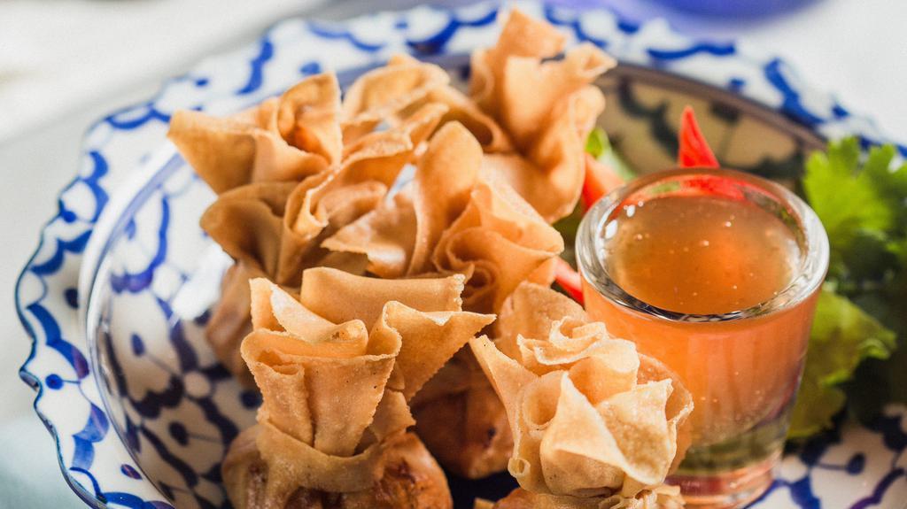 Toung Tong · Fried mini wontons of ground chicken, crab meat, shrimp, corn, green beans & carrot. Served with sweet plum sauce