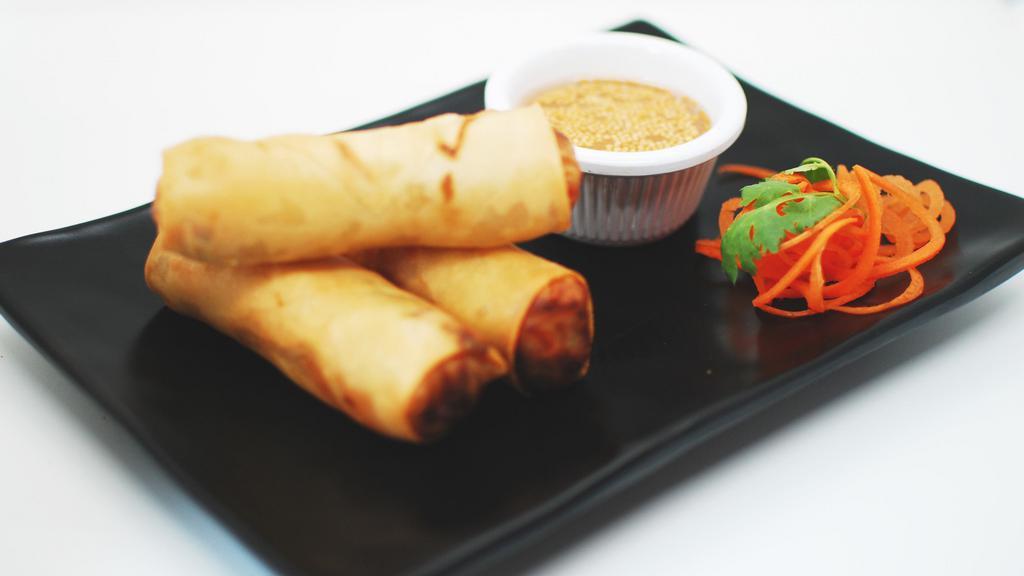 Crispy Spring Rolls · Carrot, basil, cabbage, vermicelli with lime mustard seed sauce.