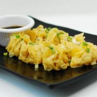 Nabon Steamed Dumplings · Chicken & shrimp dumplings with black bean vinaigrette.