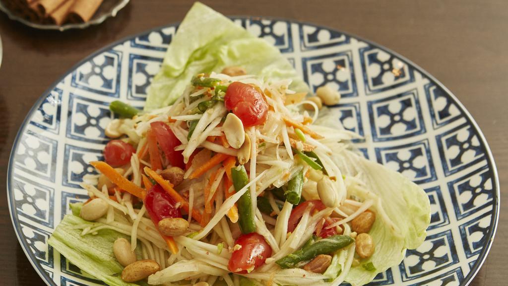 Isaan Green Papaya Salad · String beans, peanuts, cherry tomatoes, fresh chili, in chili-lime dressing. Spicy.