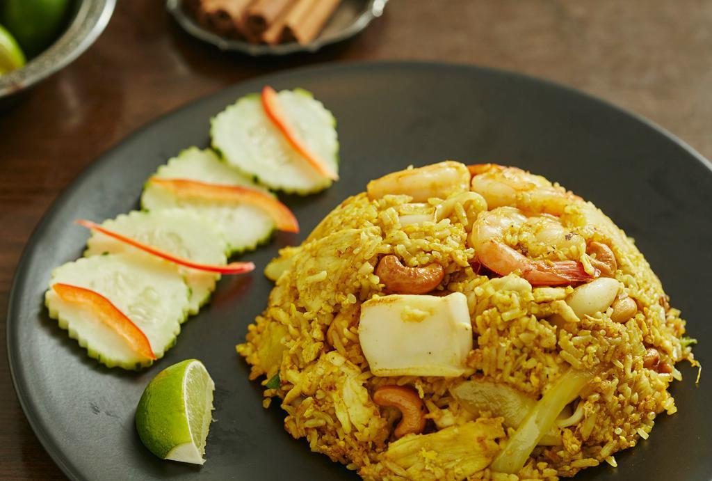 Pineapple Fried Rice · Chicken, shrimp & squid with egg & cashew nuts.