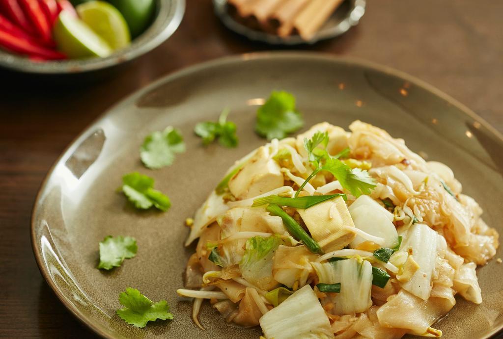 Pattaya Noodles · Broad rice noodles with tofu, radish, scallions, bean sprouts, and sesame oil. Vegetarian. Vegan.