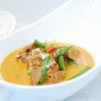 Panang Curry · Blended taste of sweet, medium spicy & little salty curry with string beans & lime leaf.