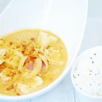 Massaman Curry · Sweet-sour-thick & mild curry with onions, peanuts & potatoes.