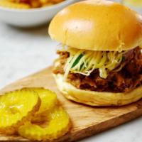 Thai Pulled Pork Sandwich  · An American favorite dressed in Thai!
Slowly roasted for 8 hours, this tender and juicy pull...