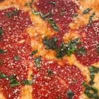 Grandma Pie · Shredded cheese, our famous sauce, chopped basil and grated parmesan cheese