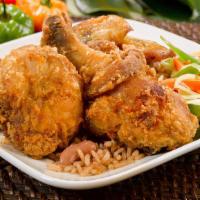 Fried Chicken · Golden brown, crunchy outside and tender inside. Fried in a well-seasoned batter with a hint...