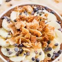 Nutty Monkey Bowl · Acai bowl topped with shredded coconut, pecans, almonds, and honey.