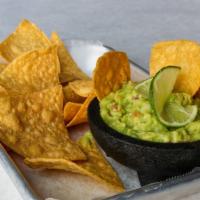 Guacamole & Chips · Made to order guacamole with tomato, onion, chilies and fresh lime juice.