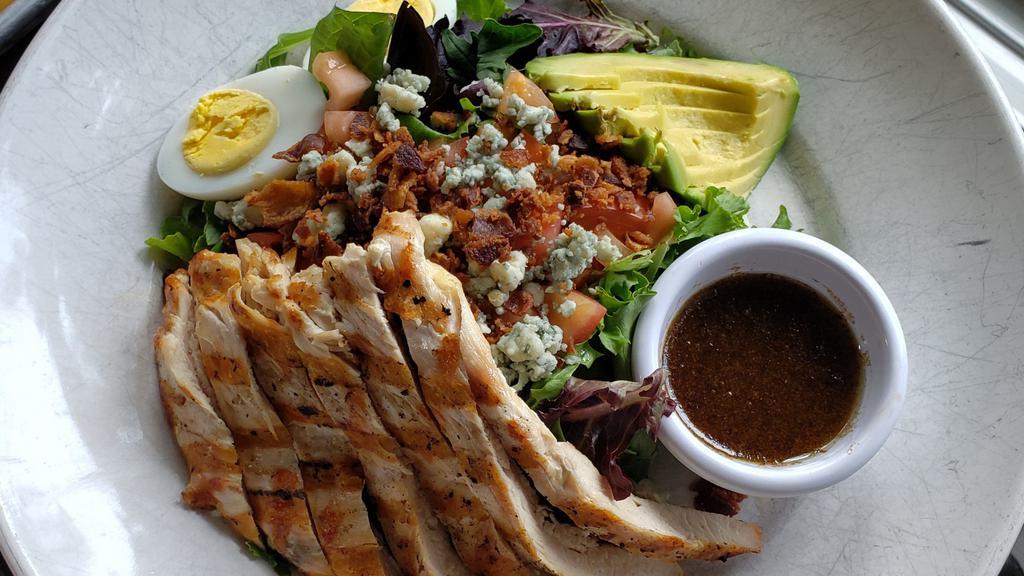 Composed Cobb Salad · Grilled chicken, baby greens, hard-boiled egg, tomato, bacon, blue cheese, avocado and balsamic dressing.