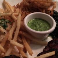Grilled Hangar Steak Chimichurri · Served with truffle parmesan fries, fried onion strings, and sautéed spinach with chimichurr...