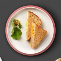 Grilled Cheese Breakfast Sandwich · Melted American cheese placed in between two buttered pieces of bread grilled until golden b...