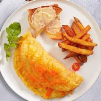 Edge Of The Cheesy Omelette · Eggs cooked as an omelette with cheddar cheese. Served with home fries or hashbrown, and you...