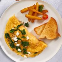 Morning Greek Omelette · Two Eggs cooked as an omelette with feta cheese, cherry tomatoes, and olives. Served with ho...