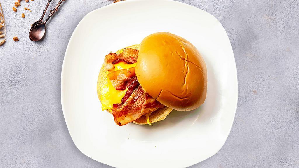Heart Attack Sandwich · Scrambled egg, bacon, ham and cheddar cheese on your choice of bread with a side of home fries.