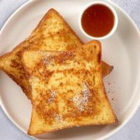 Let'S Have A French Toast · Three slices of fresh bread battered in egg, milk, and cinnamon cooked until spongy and gold...