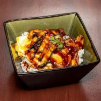 Unadon · Grilled eel bowl topped with unagi sauce; served with rice and an egg.
