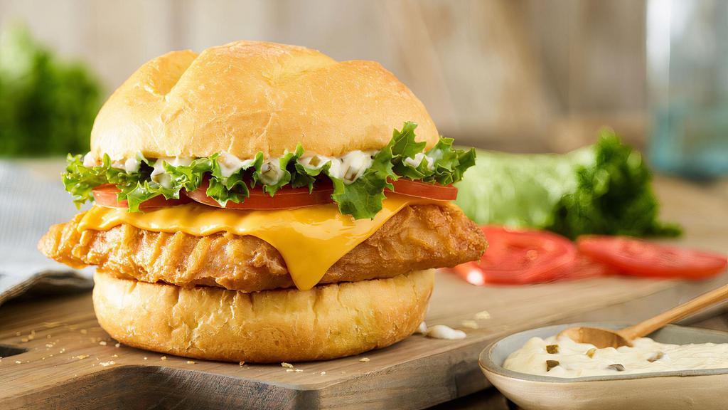 Beer Battered Pacific Cod Sandwich · Wild-caught Pacific Cod lightly dipped in a signature beer batter, American cheese, lettuce, tomatoes, tartar sauce, toasted bun