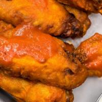 Buffalo Style Wings · Served with blue cheese